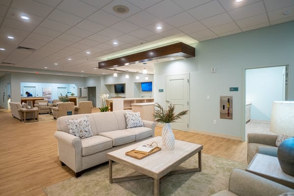 Cozy living room area with sofas and a wooden coffee table.