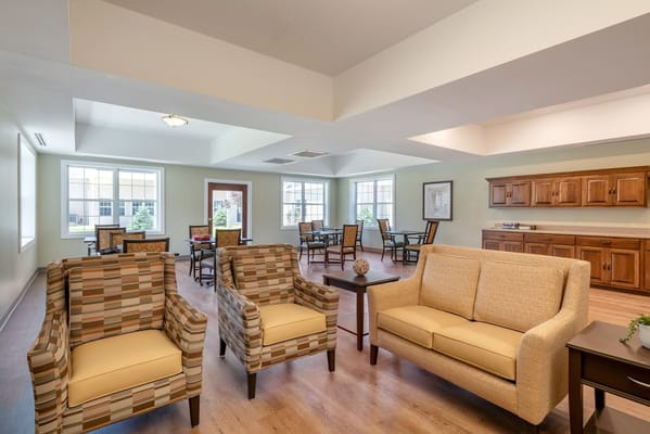 Bright common area with seating and tables