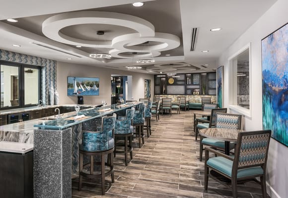 Stylish lounge area with a bar and seating at The Harrison of Stuart.