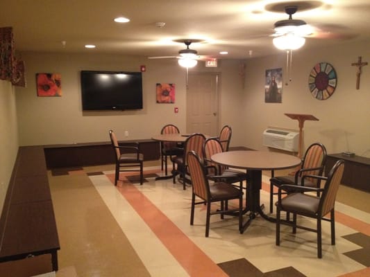 Interior view of a common area with chairs and tables