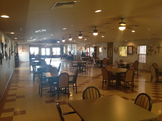Interior view of a dining room with tables and chairs