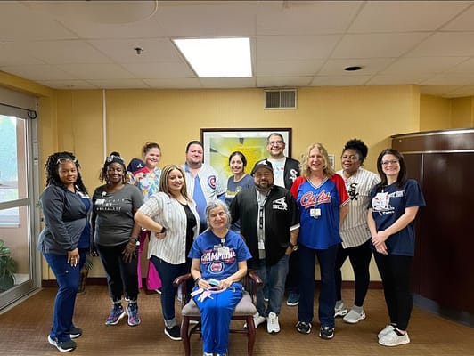 Staff and residents posing for a group photo