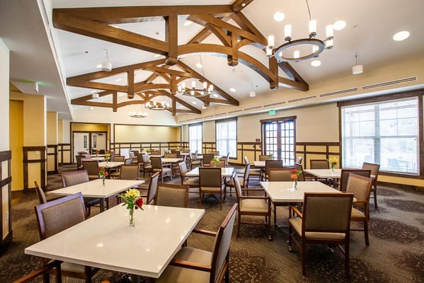 Bright and spacious dining room with tables and chairs