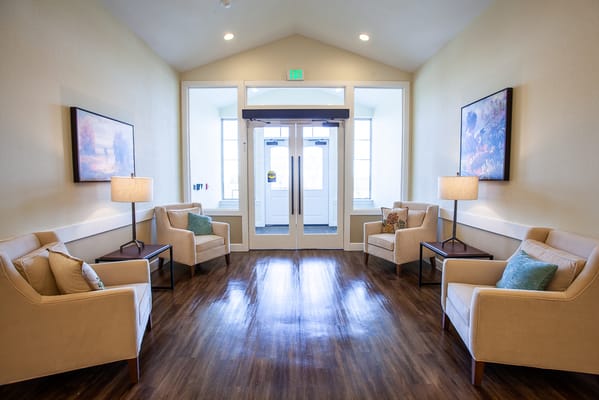 Bright lobby area with seating and natural light