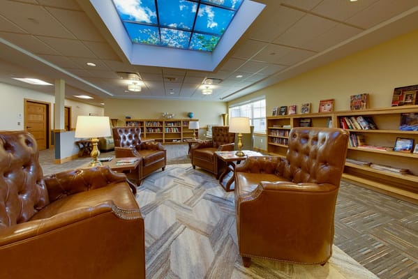 Cozy reading area with leather chairs and bookshelves