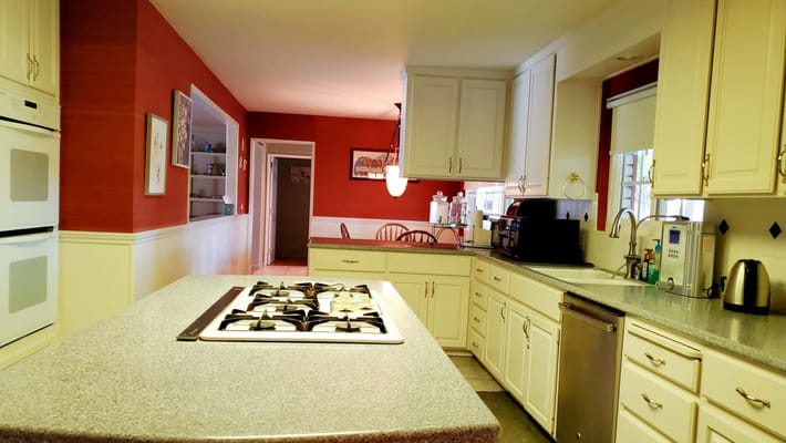 Bright kitchen area with modern appliances and decor