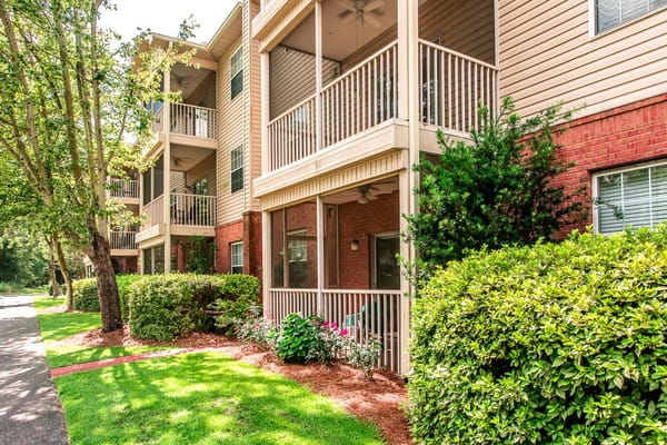 Balcony view of the Veranda of Pensacola with landscaped greenery.