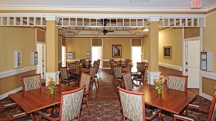 Interior view of a dining room with tables and chairs