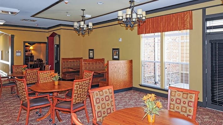 Bright common area with seating and tables