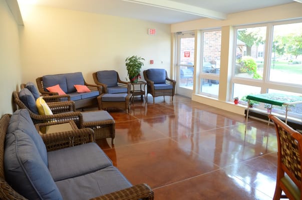 A comfortable common area with seating and natural light