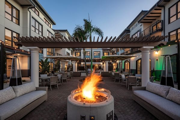 Outdoor courtyard with fire pit and seating