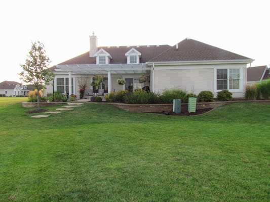 Well-maintained exterior of the Westwood Oaks facility with landscaped yard