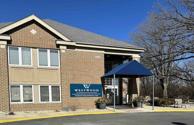Entrance of Westwood Trails & Fields Assisted Living with awning and sign.