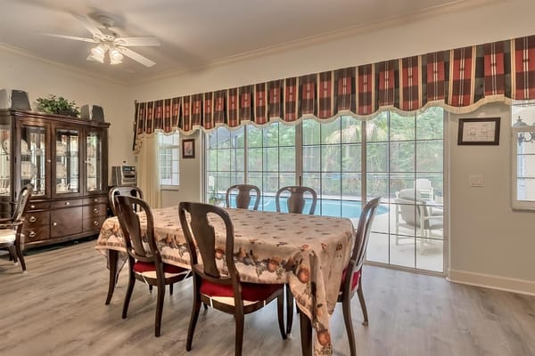 Dining area with a view of the patio and pool