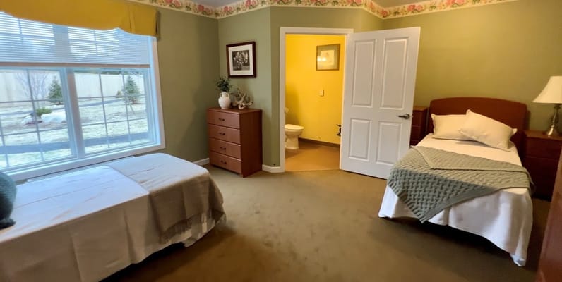 Private resident room with two beds in a cozy interior