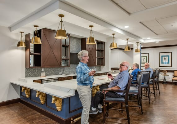 Residents enjoying drinks in a common area
