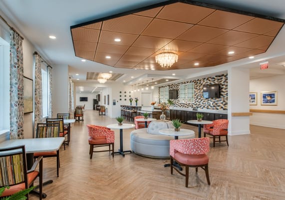 Bright and welcoming common area with seating and decorations