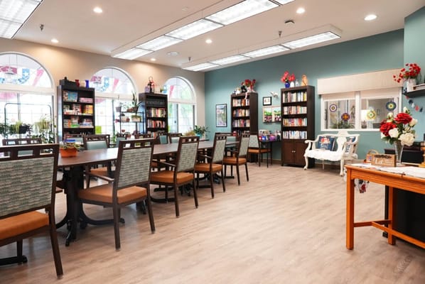 Bright common area with tables and chairs