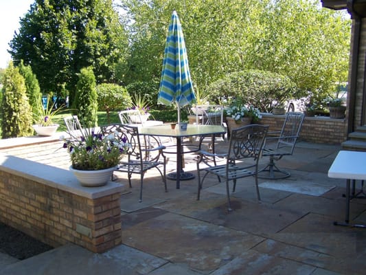 Outdoor patio with seating and umbrella