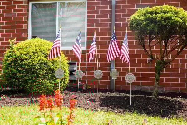 Outdoor garden area with American flags