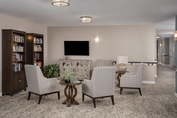 Common area with seating and bookshelf