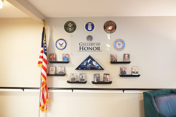 Gallery of Honor displaying military photos and insignia