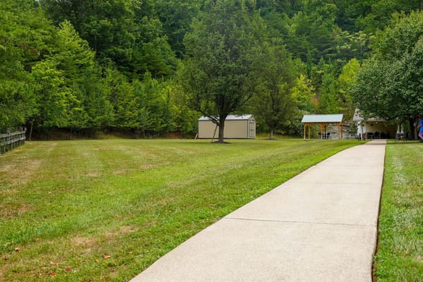 Pathway leading to outdoor space in a landscaped area