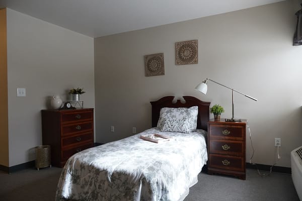 Cozy private resident room with simple furnishings