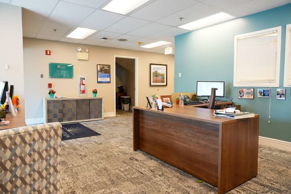 Bright interior office space with a desk and chairs