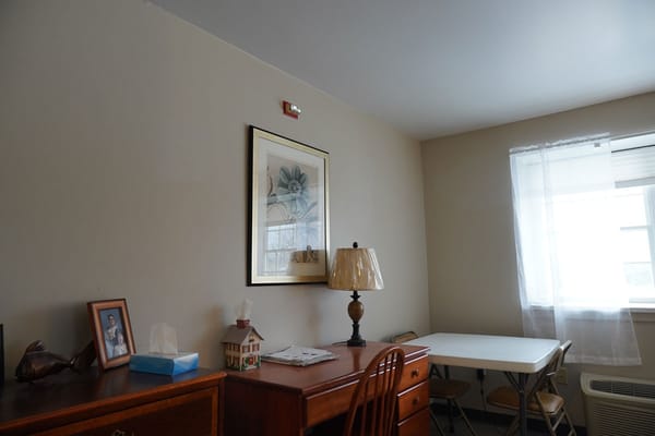 Interior of a private resident room with furniture