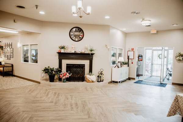 Welcoming lobby area with a fireplace and seating