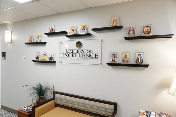 Interior view of a recognition gallery with resident photos