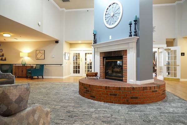 Common area with a fireplace and comfortable seating
