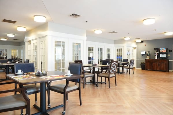 Bright dining area with tables and chairs