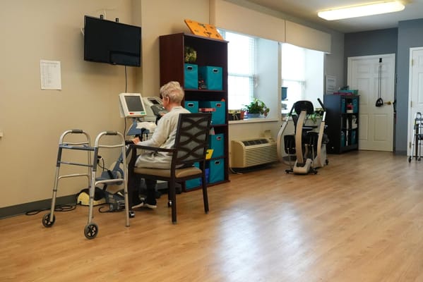 Resident participating in a wellness activity in a common area