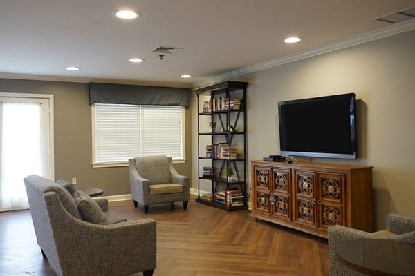 Interior common area with seating and bookshelves