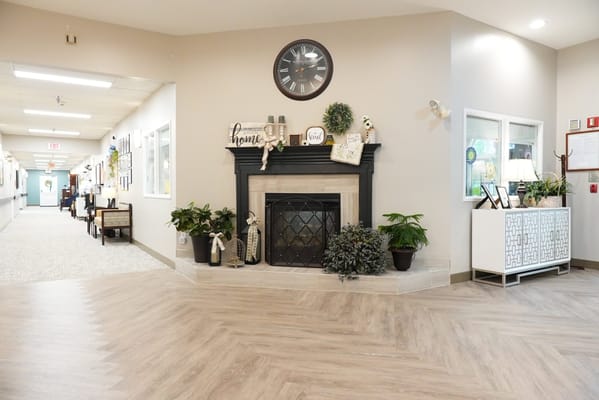 Interior view of a cozy common area with a fireplace