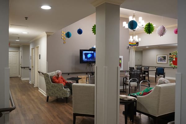 Common area with residents and seating