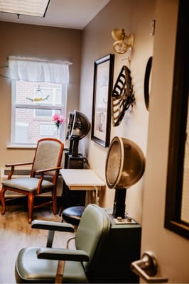 Interior room with salon chairs and styling equipment