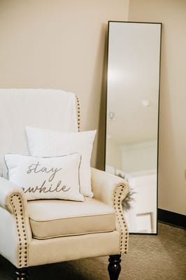 Cozy armchair with decorative pillows in a living space