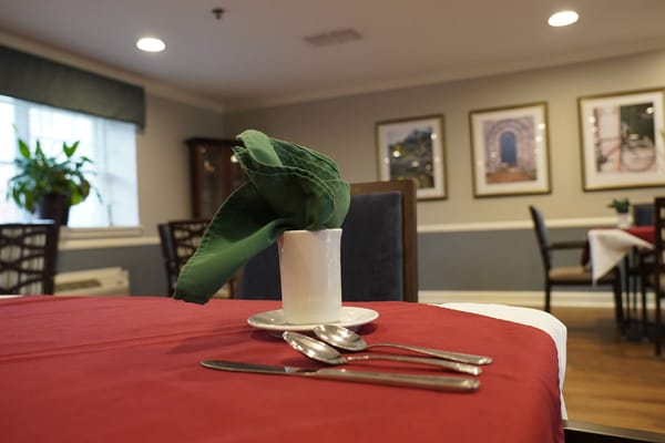 Dining table set with utensils in an inviting dining area