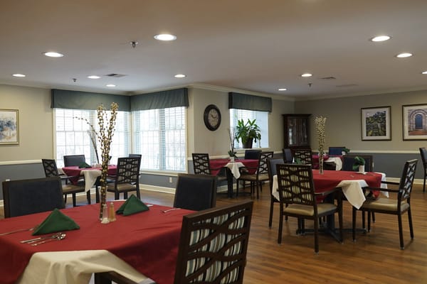 Interior of a dining area with tables set for meals