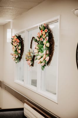 Colorful floral wreaths decorating an interior wall