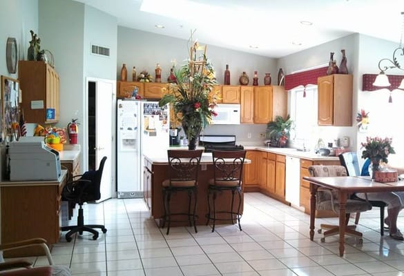 Bright and inviting kitchen with a dining area and floral decor
