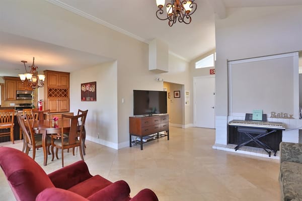 Bright interior common area with seating and dining space