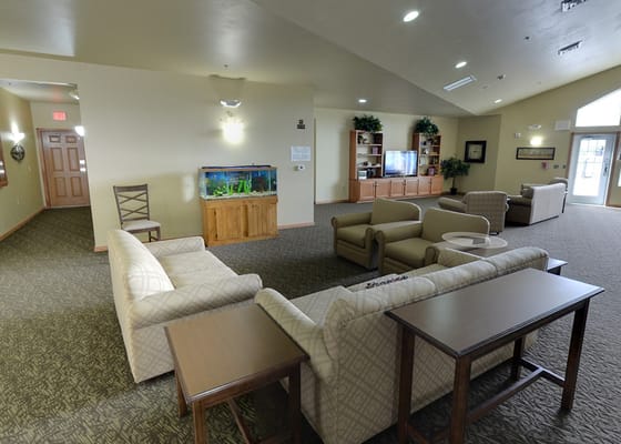 Interior view of a common area with seating and aquarium
