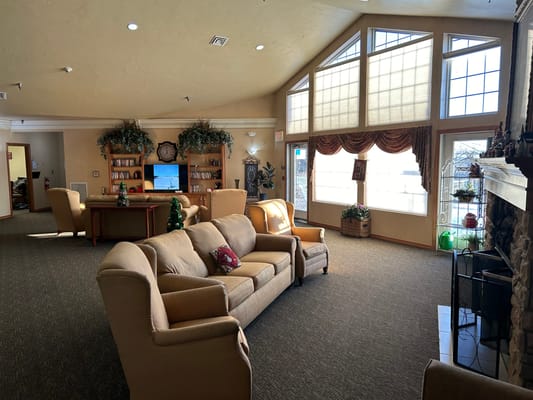 Bright common area with seating and windows