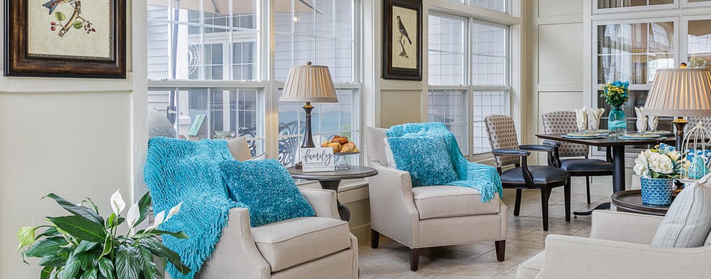 Bright lounge area with comfortable seating and decor