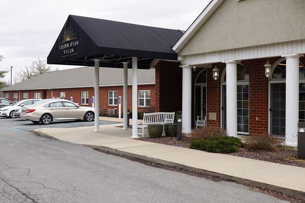 Exterior view of Celebration Villa with covered entrance