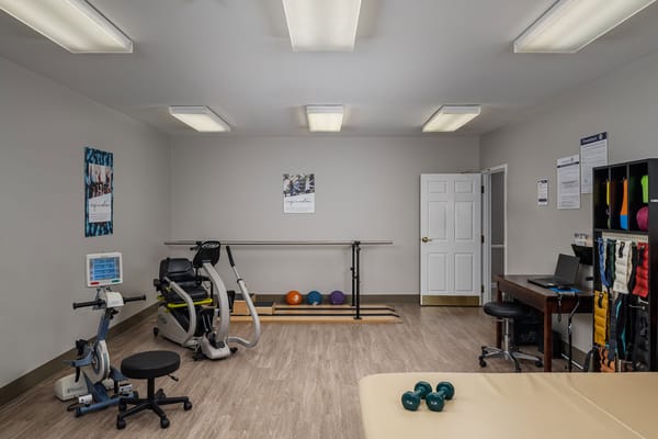 Well-equipped therapy room with exercise equipment